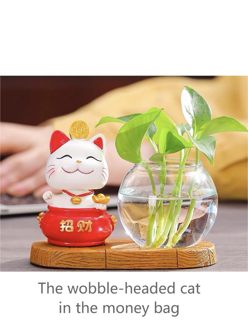Glass hydroponic vase with wobble-headed cat décor